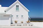 White beach house with sunny ocean view