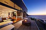 Fire pit on modern luxury home showcase beach house at sunset