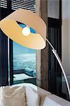 Arc sectional lamp in luxury living room with ocean view