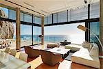 Modern luxury home showcase living room with sunny ocean view