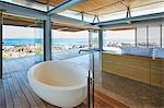 Modern luxury home showcase bathroom and sink with ocean view