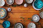 Directly above shot of multi colored pottery on wooden table