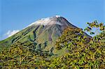 Costa Rica, Alajuela Province, Arenal.  Arenal Volcano with steam rising from its peak.  This active stratovolcano erupted last in 2010.