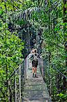 Costa Rica, Alajuela Province, La Fortuna, Arenal.  A hanging bridge walkway in the beautiful forest surrounding the Arenal Hanging Bridges trails.