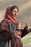 Ladakhi woman with prayer wheel, Indus Valley