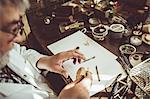 Horologist repairing a watch in the workshop