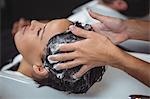 Woman getting her hair wash at a salon