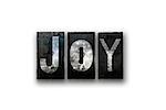 The word "JOY" written in vintage, dirty, ink stained letterpress type and isolated on a white background.