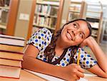 Happy Hispanic Girl Student with Pencil and Books Daydreaming While Studying in Library.
