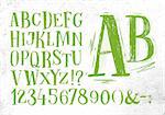Font pencil vintage hand drawn alphabet drawing in green color on dirty paper background.