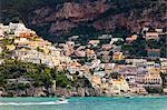 Cliff side buildings by sea, Positano, Amalfi Coast, Italy