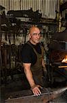 Portrait of blacksmith at work