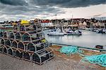 Sailing boats and crab pots at dusk in the harbour at Anstruther, Fife, East Neuk, Scotland, United Kingdom, Europe