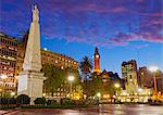 Argentina, Buenos Aires Province, City of Buenos Aires, Monserrat, Twilight view of Piramide de Mayo and Cabildo on Plaza de Mayo.