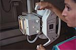 Female doctor working with x-ray machine at the hospital