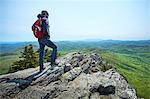 Male hiker looking out from ridge, Blue Ridge Mountains, North Carolina, USA