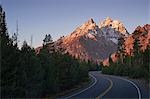 Winding road through mountain landscape, Grand Teton National Park, Wyoming, USA