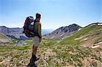 Male backpacker looking out at landscape, Never Summer Wilderness, Colorado, USA