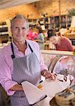 Portrait smiling deli worker in grocery store