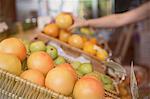 Close up fresh oranges in basket at market