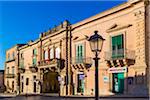 Traditional architecture and street scene in Ragusa in Sicily, Italy