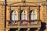 Close-up of decorated balcony with window boxes of flowers in Ragusa in Sicily, Italy