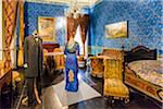 Bedroom interior with mannequins dressed in historic clothing at Donnafugata Castle in Ragusa in the Province of Ragusa in Sicily, Italy