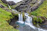 Small waterfall just outside the town of Grundarfjordur on the Snaefellsnes Peninsula, Iceland, Polar Regions