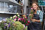 Portrait of a happy woman holding a flower