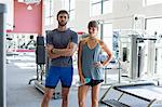 Young couple standing a fitness club