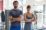 Portrait of a young couple standing in health club