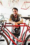 A man working in a bicycle repair shop.