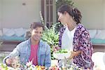 Wife serving salad to husband