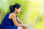 Woman using laptop computer outdoors