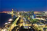 Skyline and Corniche, Al Markaziyah district by night, Abu Dhabi, United Arab Emirates, Middle East