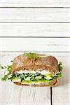 Green sandwich with soft cheese, avocado and fresh cucumber.