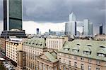 Old residences and modern office buildings at Warsaw city center. Cloudy Day.