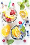 Fresh summer fruit detox iced water with berries and citrus.
