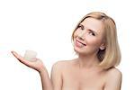 Beautiful middle aged woman with smooth skin and short blond hair holding moisturizing cream. Beauty shot. Isolated over white background. Copy space.