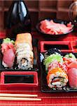 Assorted of fresh delicious sushi and rolls on table, japanese food