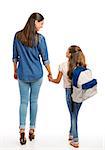 Mother and her little daughter walking together going to the school