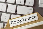 Compliance written on  Folder Index on Background of White Modern Computer Keypad. Business Concept. Closeup View. Blurred Toned Image. 3D Rendering.