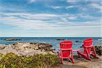 Red chairs facing Keji Seaside beach (South Shore, Nova Scotia, Canada)