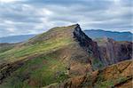 Mountain landscape of Madeira east coast. Famous hiking path through the fields and hills of volcanic tail of the island. Madeira, Portugal.