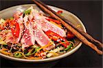 Delicious grilled tuna and  asian rice glass noodles with vegetables