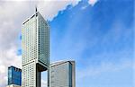 Top of modern skyscrapers and blue sky, copy space.