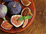 Natural ripe figs on a wooden board