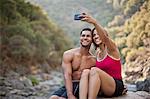 Smiling young couple posing for a self portrait.