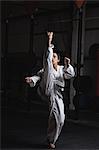 Woman practicing karate in fitness studio