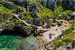 Stone staircase and small beach at the coastal town of Gagliano del Capo in Puglia, Italy